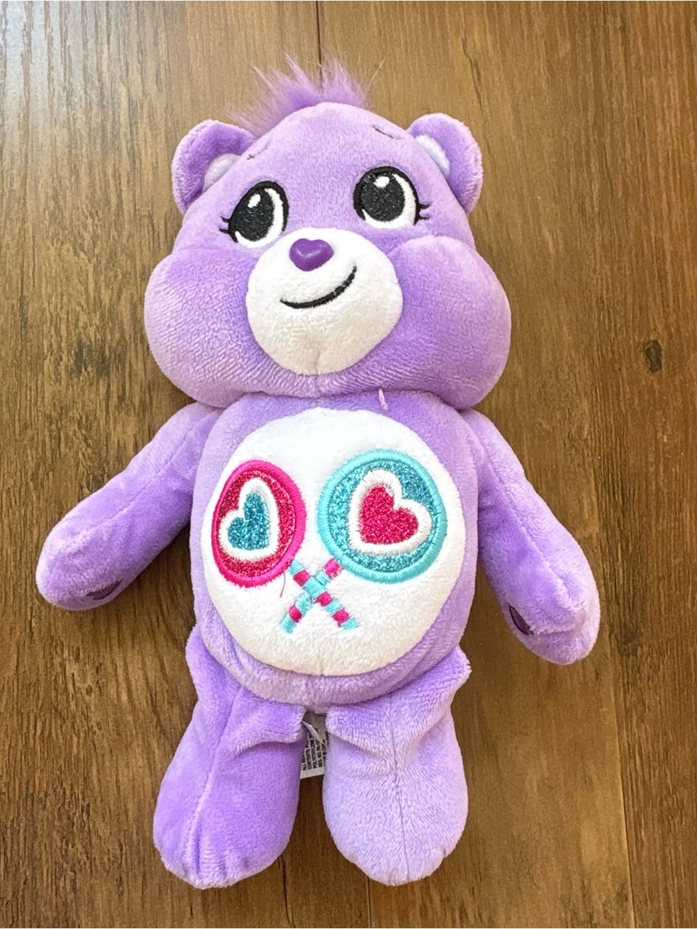 Care Bear Purple Plush Toy with Heart Lollipop Belly Badge. INV25/571